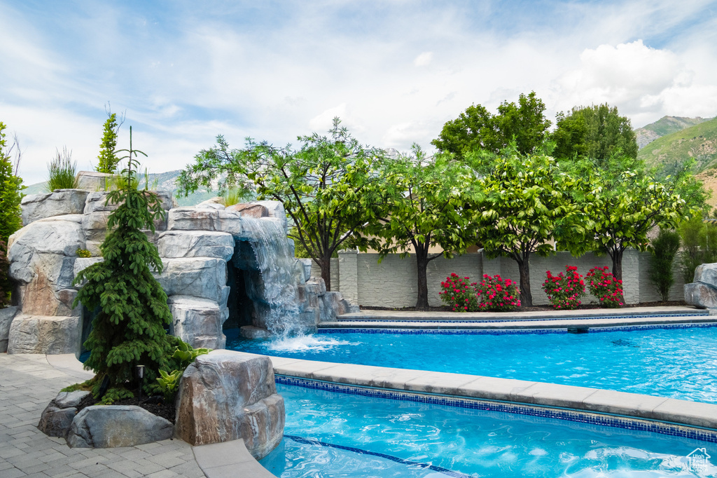 Outdoor pool with a mountain view