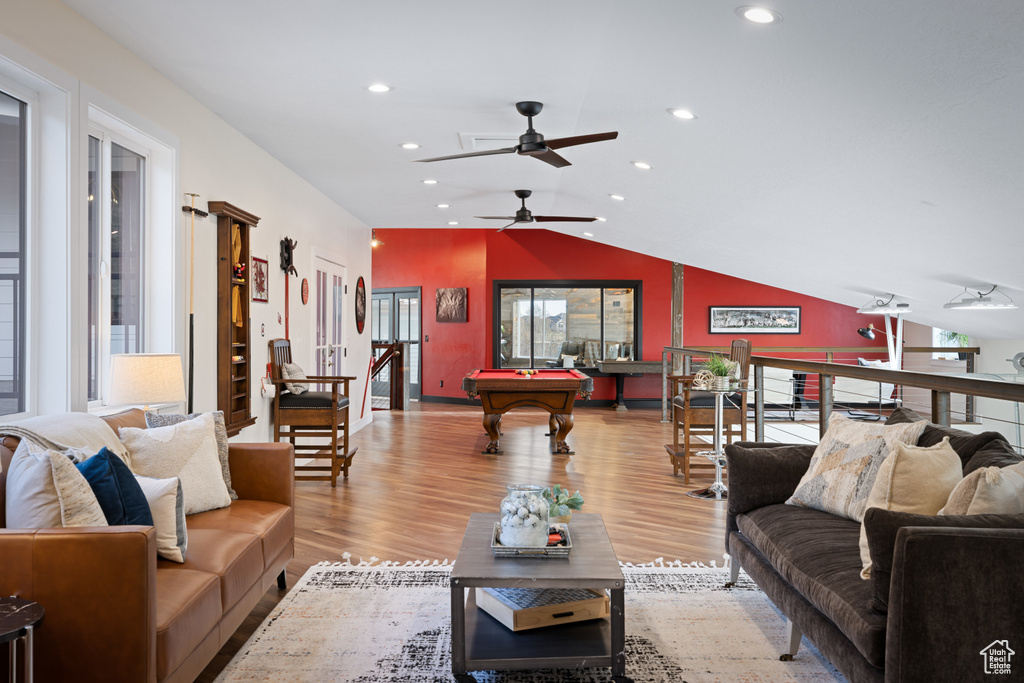 Living room with recessed lighting, lofted ceiling, wood finished floors, ceiling fan, and pool table