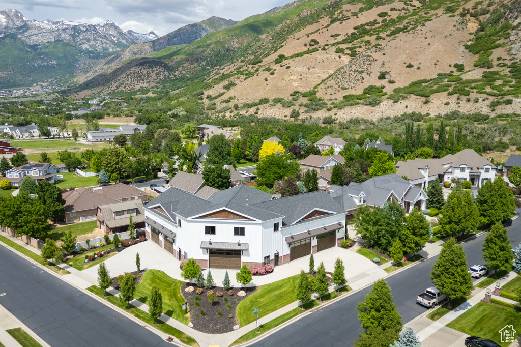 Aerial perspective of suburban area featuring a mountain backdrop