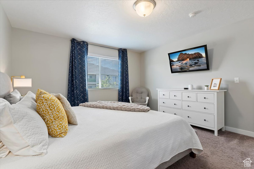 Carpeted bedroom with baseboards