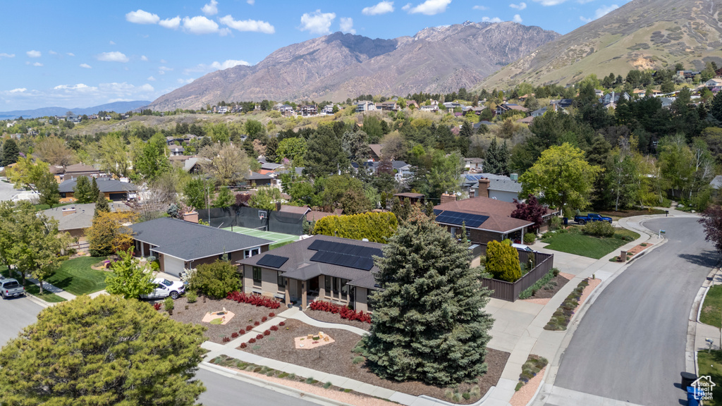 Drone / aerial view with a residential view and a mountain view