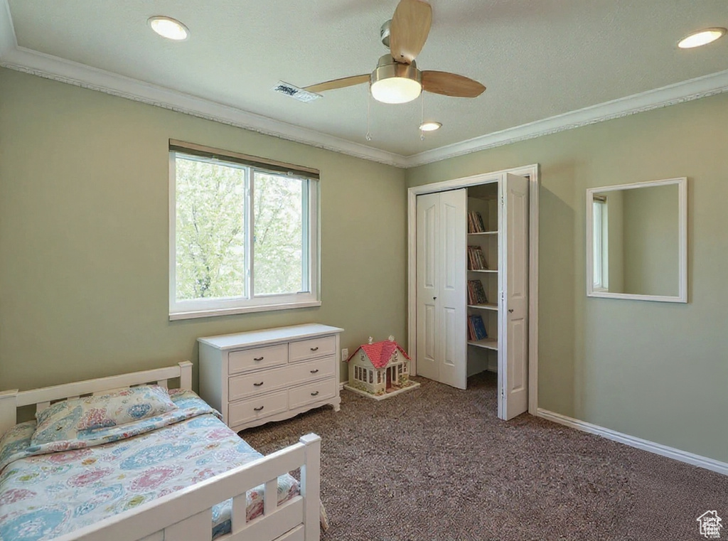Bedroom with ornamental molding, dark colored carpet, recessed lighting, a closet, and ceiling fan