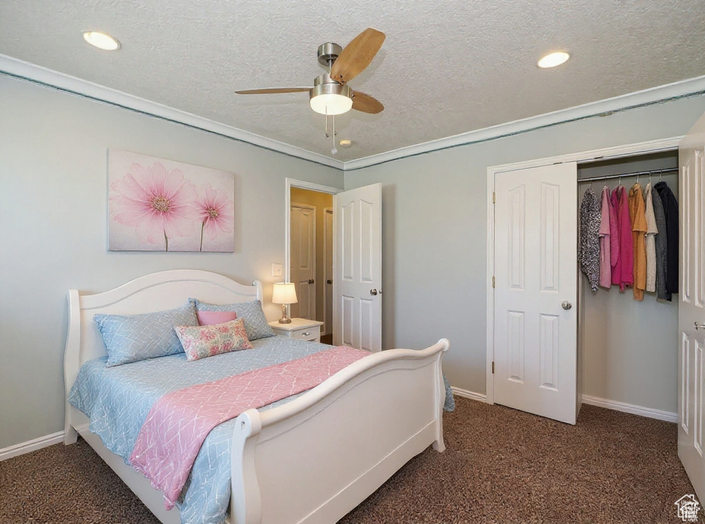 Carpeted bedroom featuring recessed lighting, a textured ceiling, crown molding, ceiling fan, and a closet