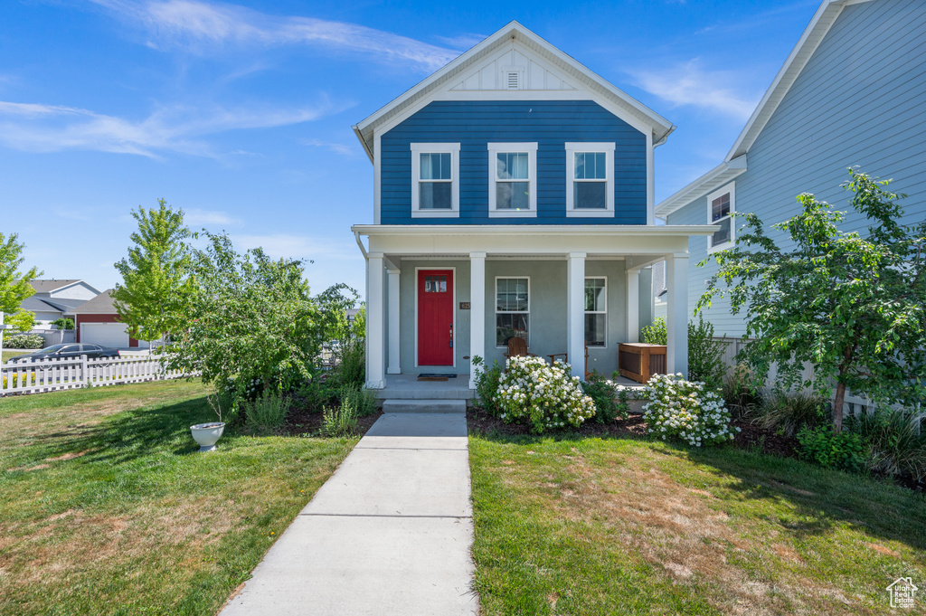 View of front of house featuring a porch and stucco siding