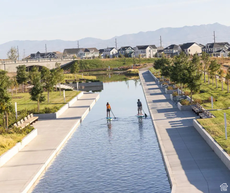 View of property's community with a water and mountain view and a residential view