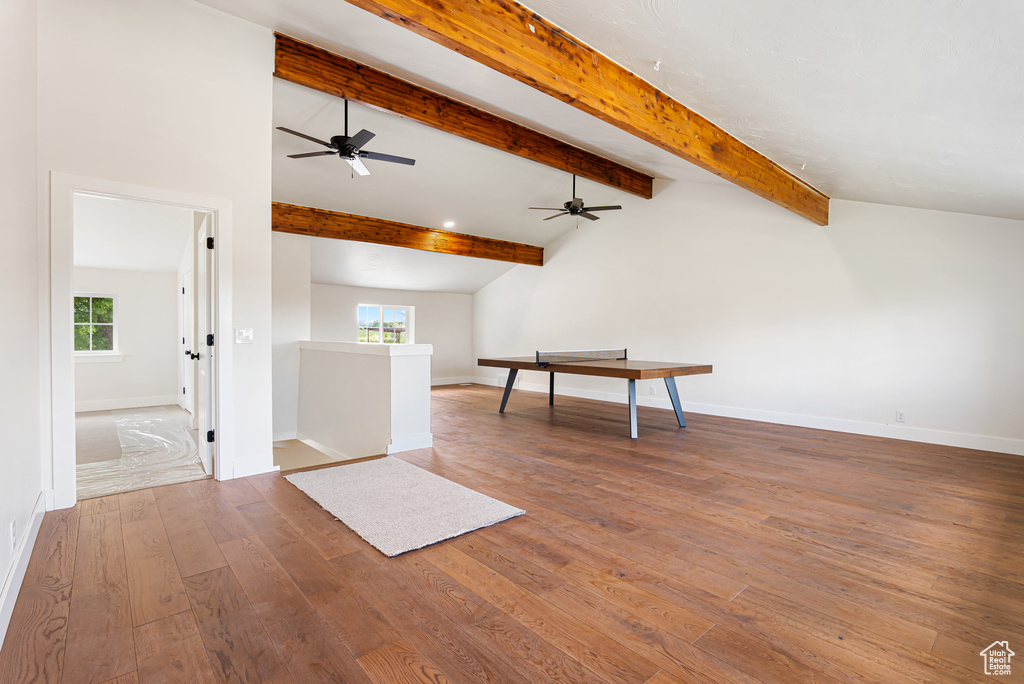 Bonus room with plenty of natural light, ceiling fan, hardwood / wood-style flooring, and baseboards
