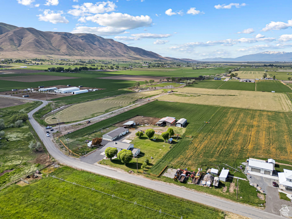 View of rural area featuring farmland and a mountainous background