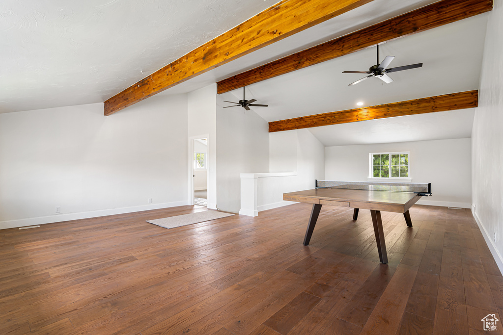 Rec room featuring baseboards, a ceiling fan, and wood-type flooring