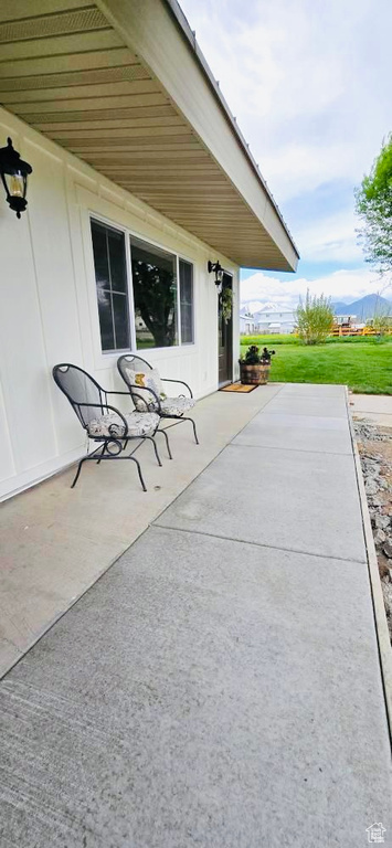 View of patio / terrace with a mountain view