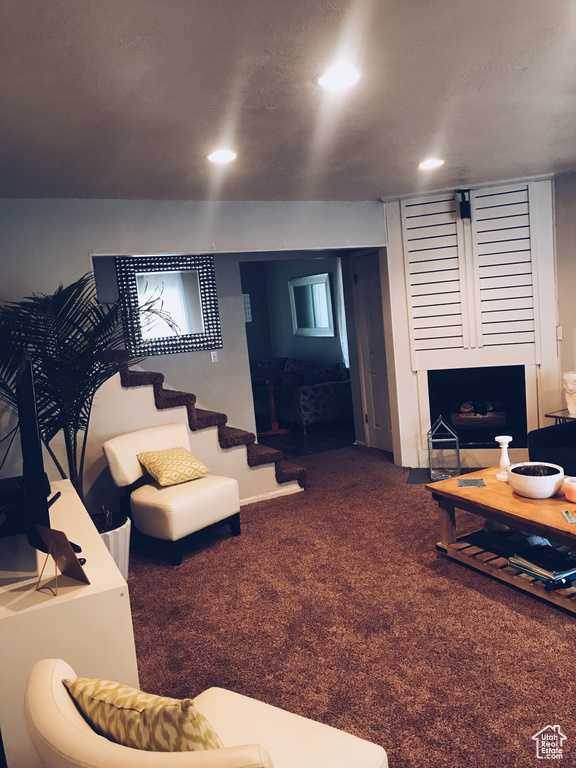 Carpeted living area featuring recessed lighting