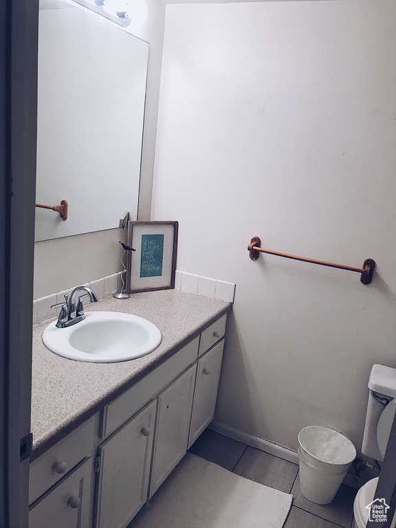 Bathroom with toilet and vanity