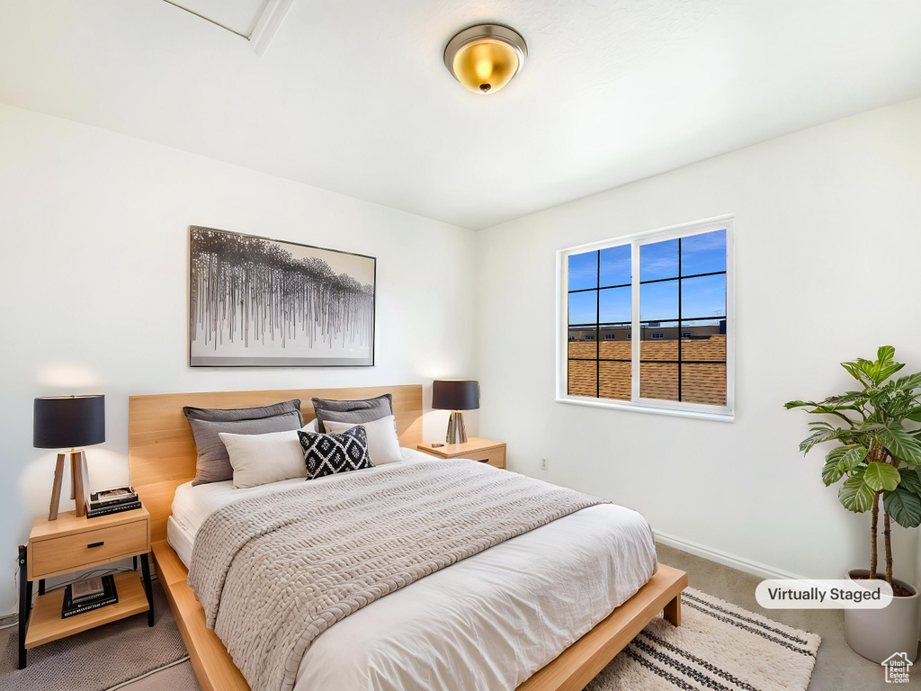 Bedroom with carpet and baseboards
