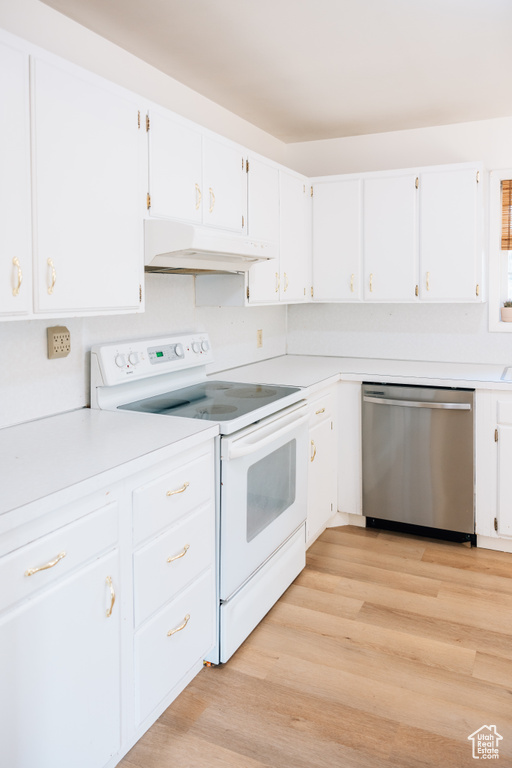 Kitchen featuring under cabinet range hood, light countertops, dishwasher, white electric range oven, and white cabinetry