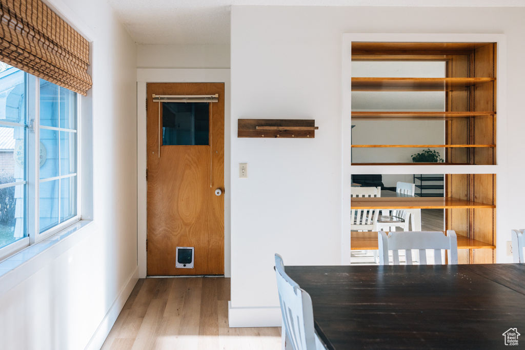 Interior space featuring baseboards and wood finished floors