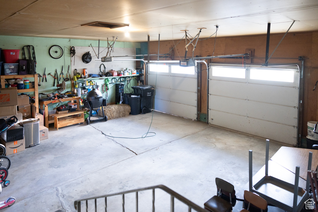 Garage featuring a garage door opener