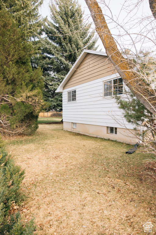 View of home\'s exterior featuring a yard