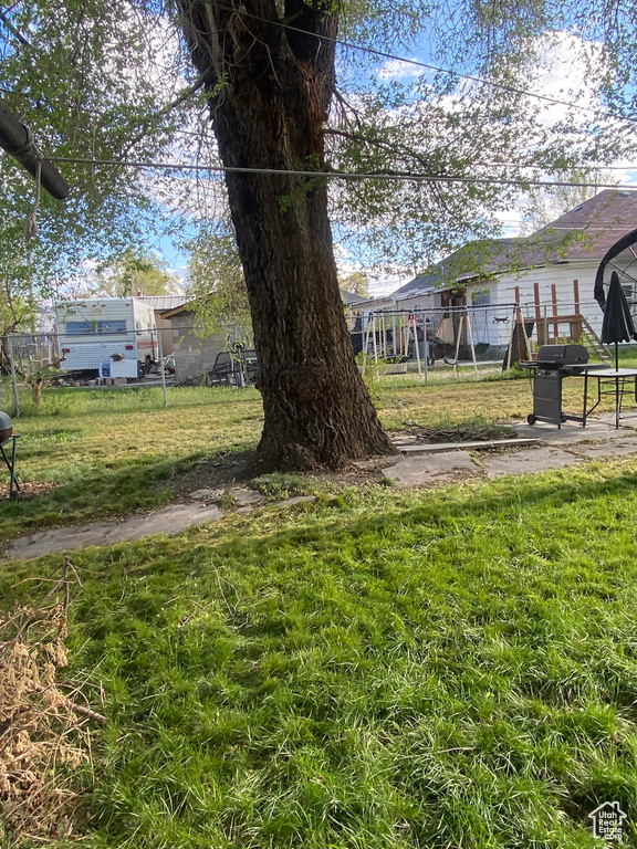View of yard featuring fence