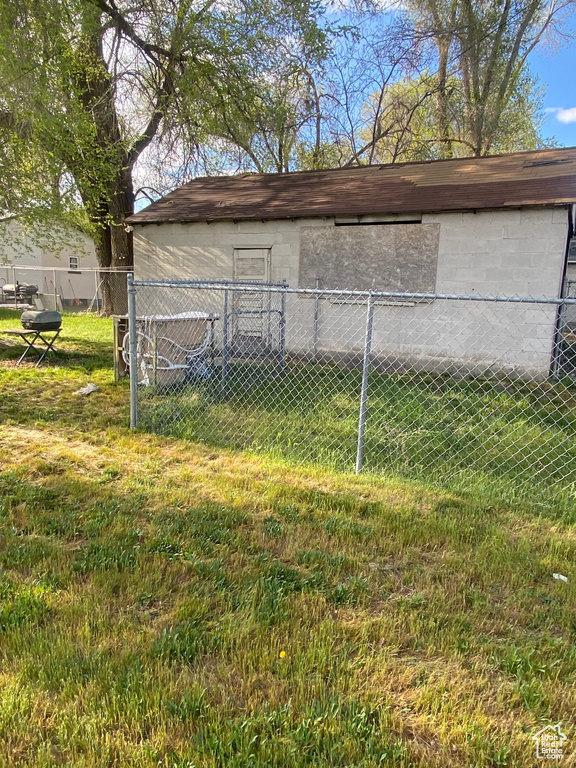 View of outdoor structure with fence