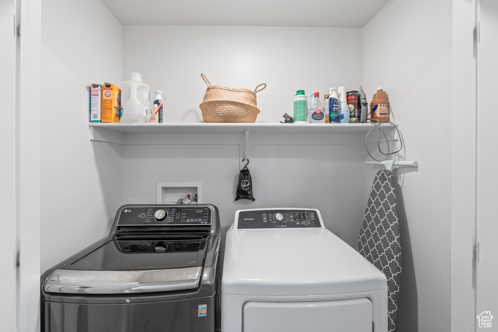 Laundry room featuring independent washer and dryer and laundry area