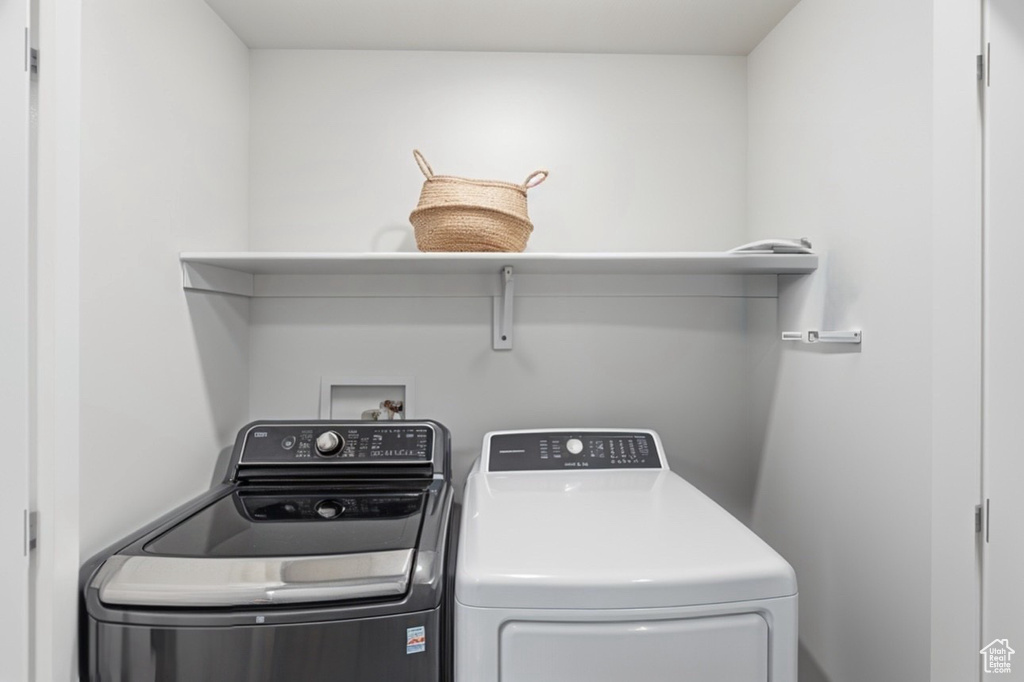 Laundry area featuring washing machine and clothes dryer