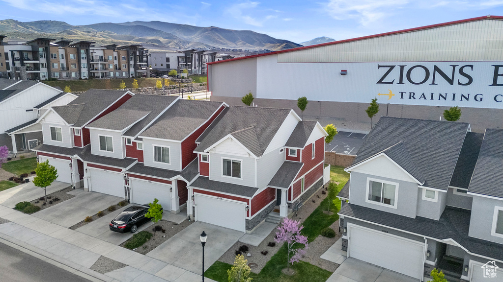 Drone / aerial view with a mountain view and a residential view