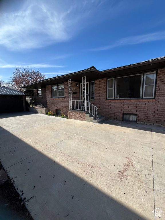 Single story home with brick siding