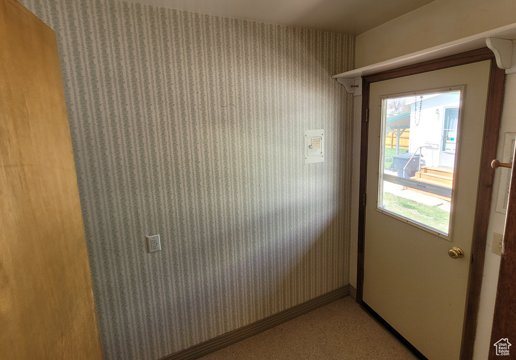 Entryway with wallpapered walls