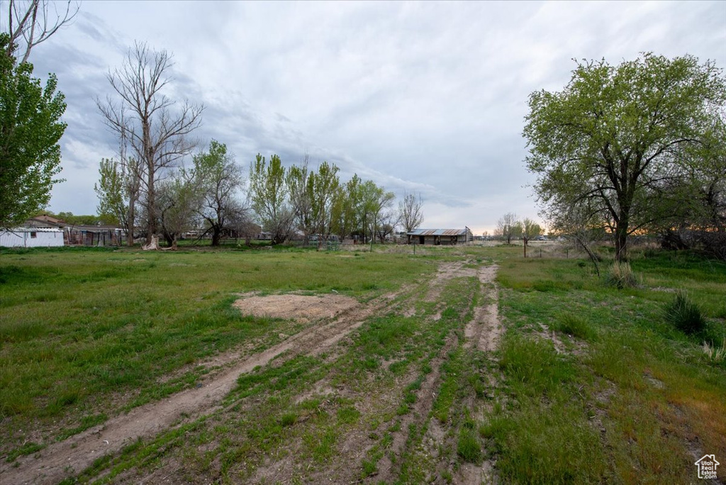 View of street with a rural view and driveway