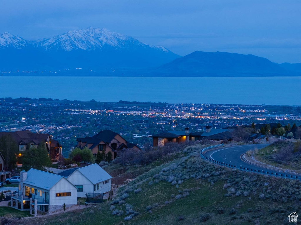 Drone / aerial view featuring a water and mountain view