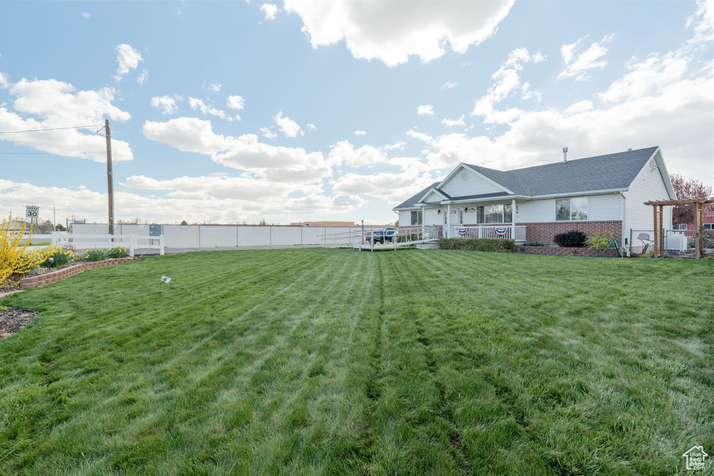 View of yard with fence
