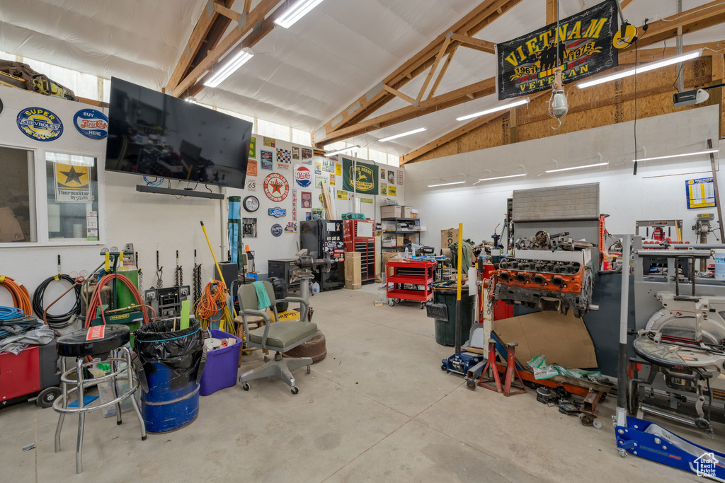 Garage with a workshop area and a garage door opener