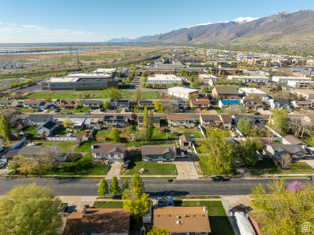 Birds eye view of property with a residential view and a water and mountain view