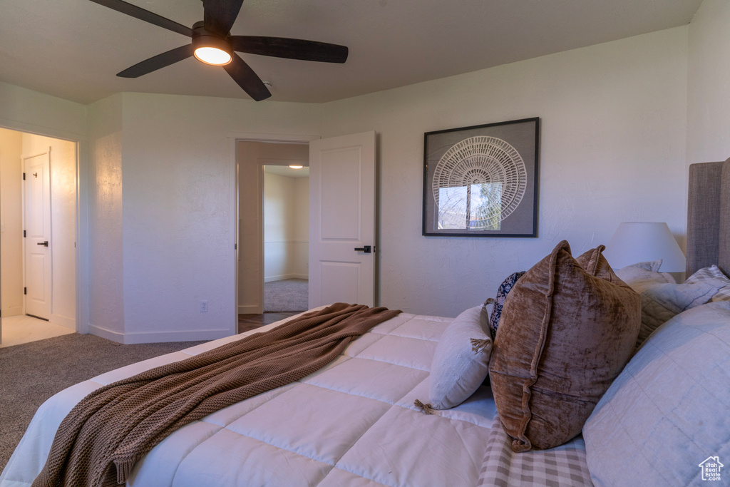 Bedroom featuring a ceiling fan and carpet flooring