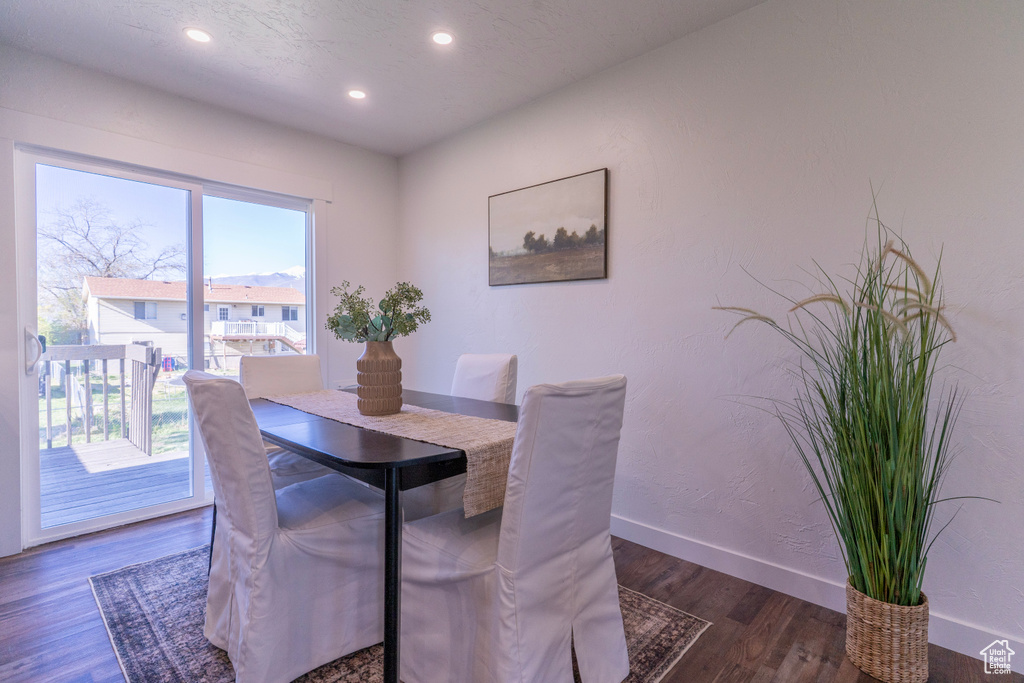 Dining area with recessed lighting, wood finished floors, and baseboards