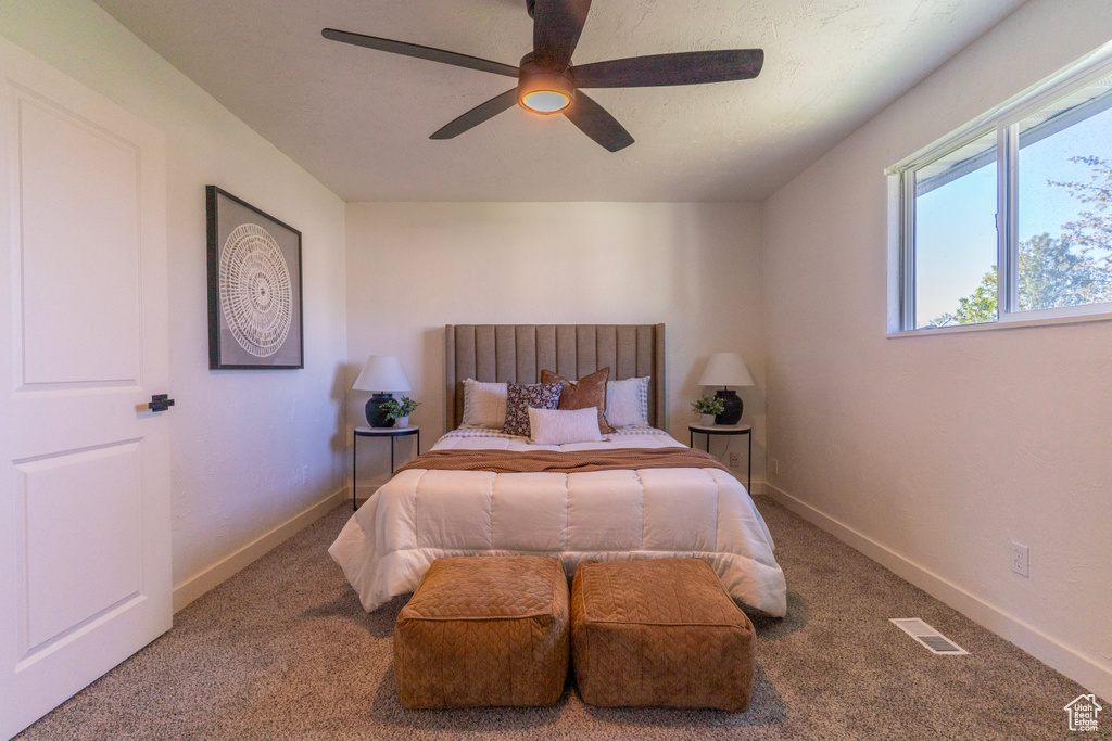 Bedroom featuring visible vents, carpet, and baseboards