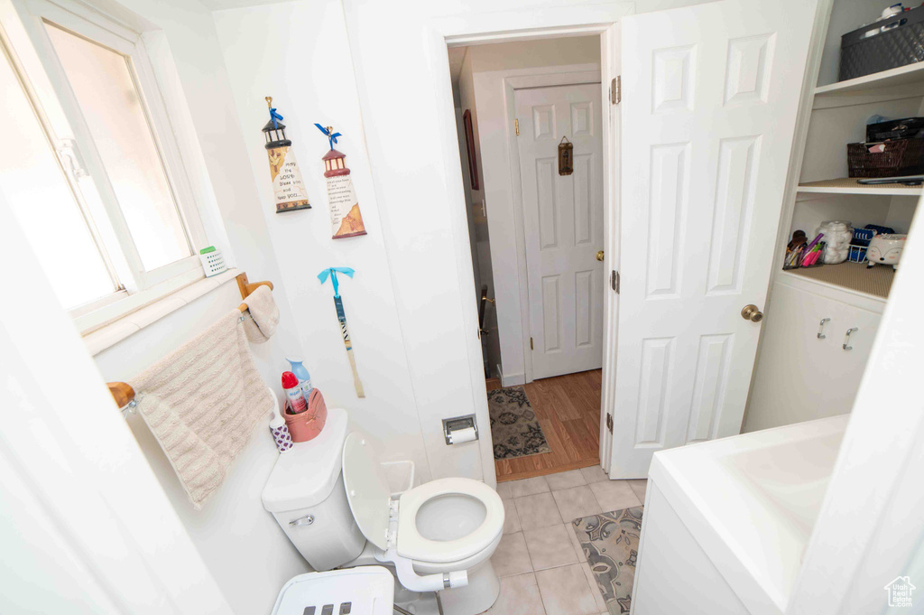 Bathroom featuring tile patterned floors and toilet