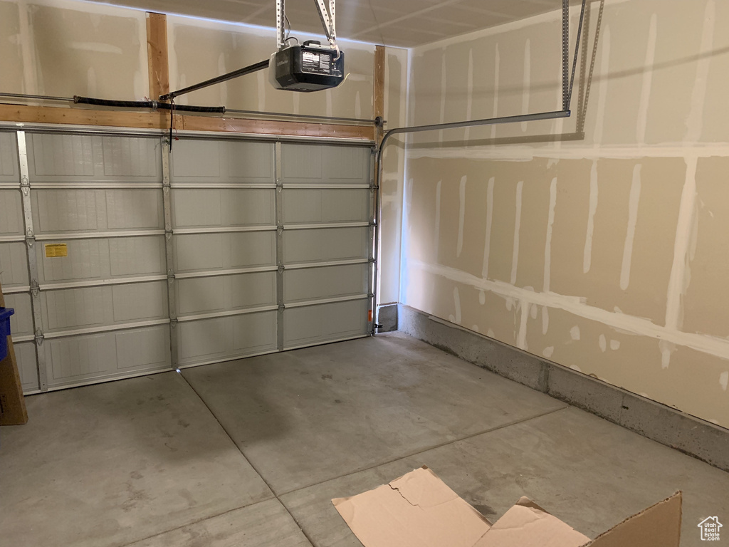 Garage featuring a garage door opener