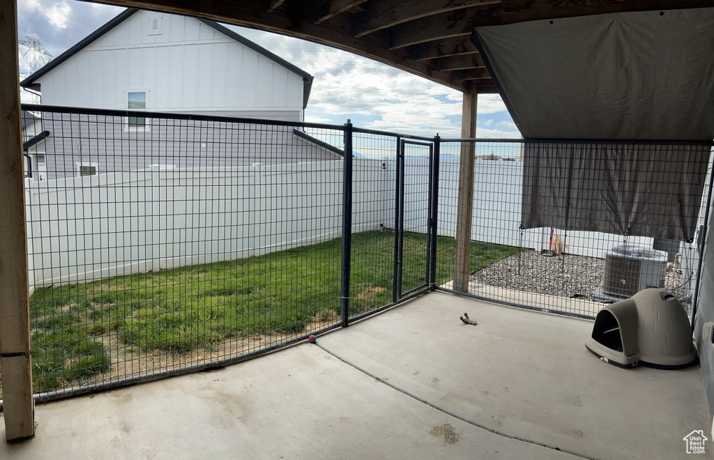 View of patio featuring a fenced backyard and central AC