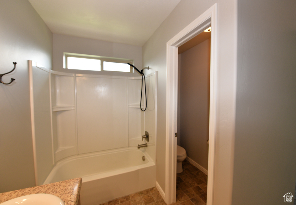 Bathroom with vanity and shower / bathtub combination