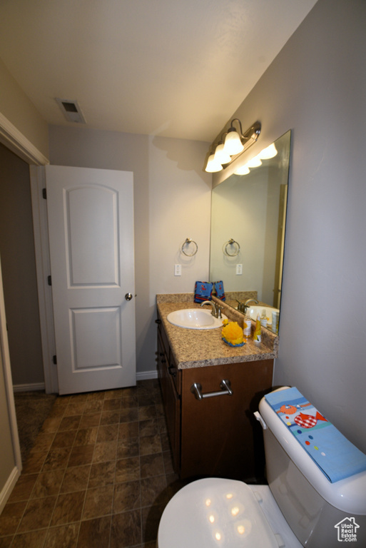 Half bath with toilet and vanity