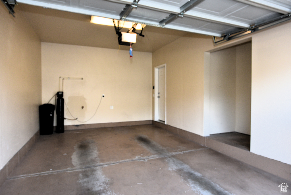 Garage featuring a garage door opener