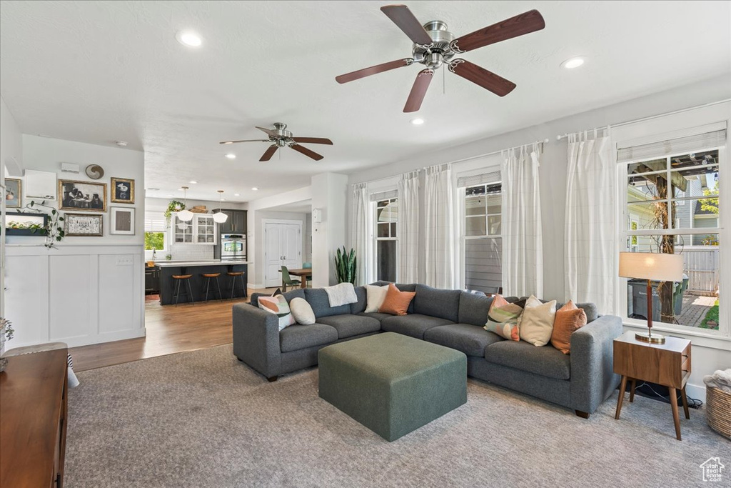 Living area featuring recessed lighting, ceiling fan, and a healthy amount of sunlight