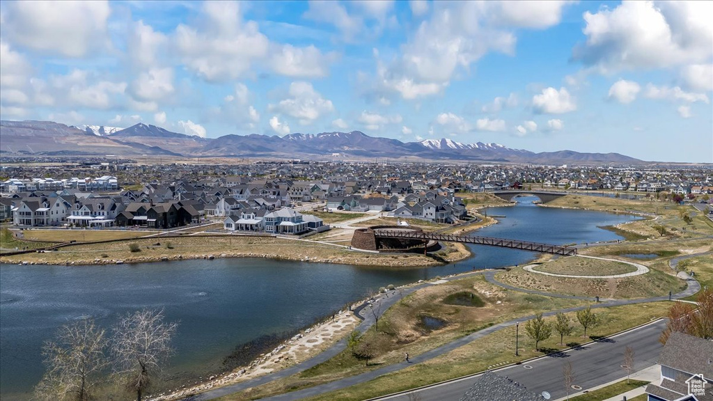 Aerial view featuring a water and mountain view and a residential view