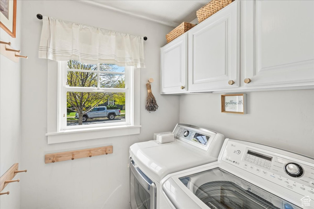 Laundry area with washing machine and dryer and cabinet space