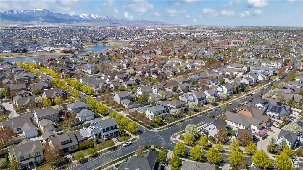 Birds eye view of property with a residential view and a water and mountain view