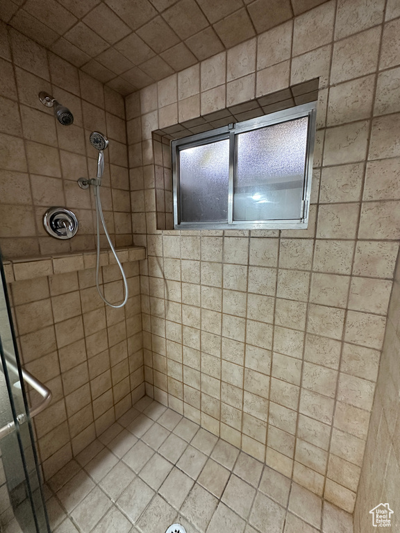 Full bathroom featuring a shower stall