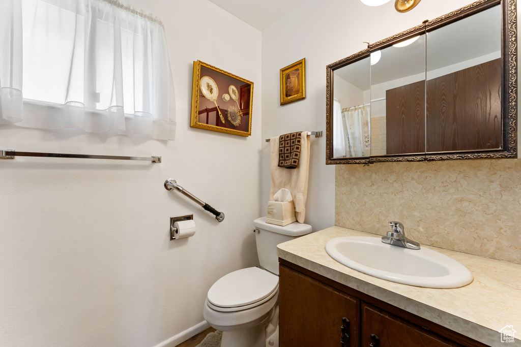 Bathroom with toilet and vanity