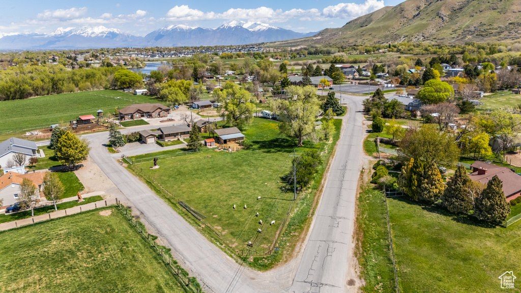 Drone / aerial view featuring a residential view and a water and mountain view