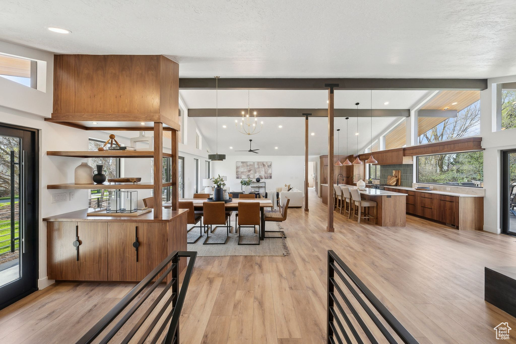 Dining room with an inviting chandelier and light wood-type flooring