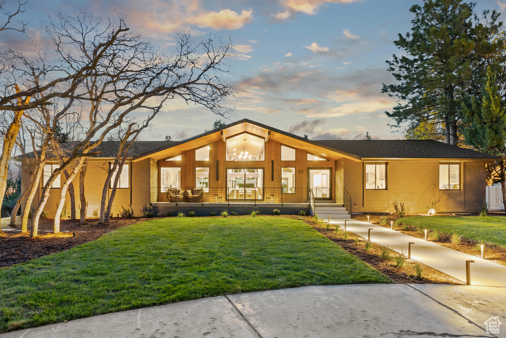 Mid-century inspired home featuring a yard